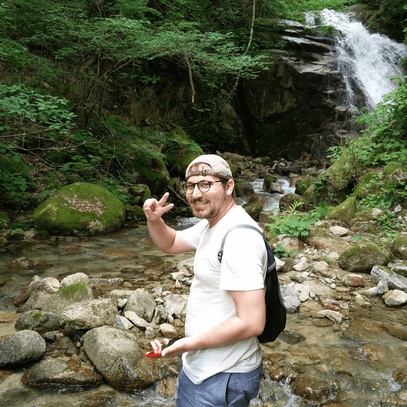 Brandon Odom outdoors near a waterfall